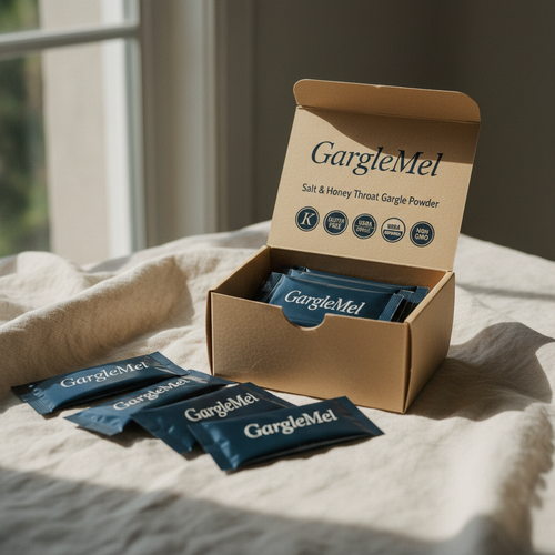 Open GargleMel carton with navy single-use sachets — Salt & Honey Throat Gargle Powder.
